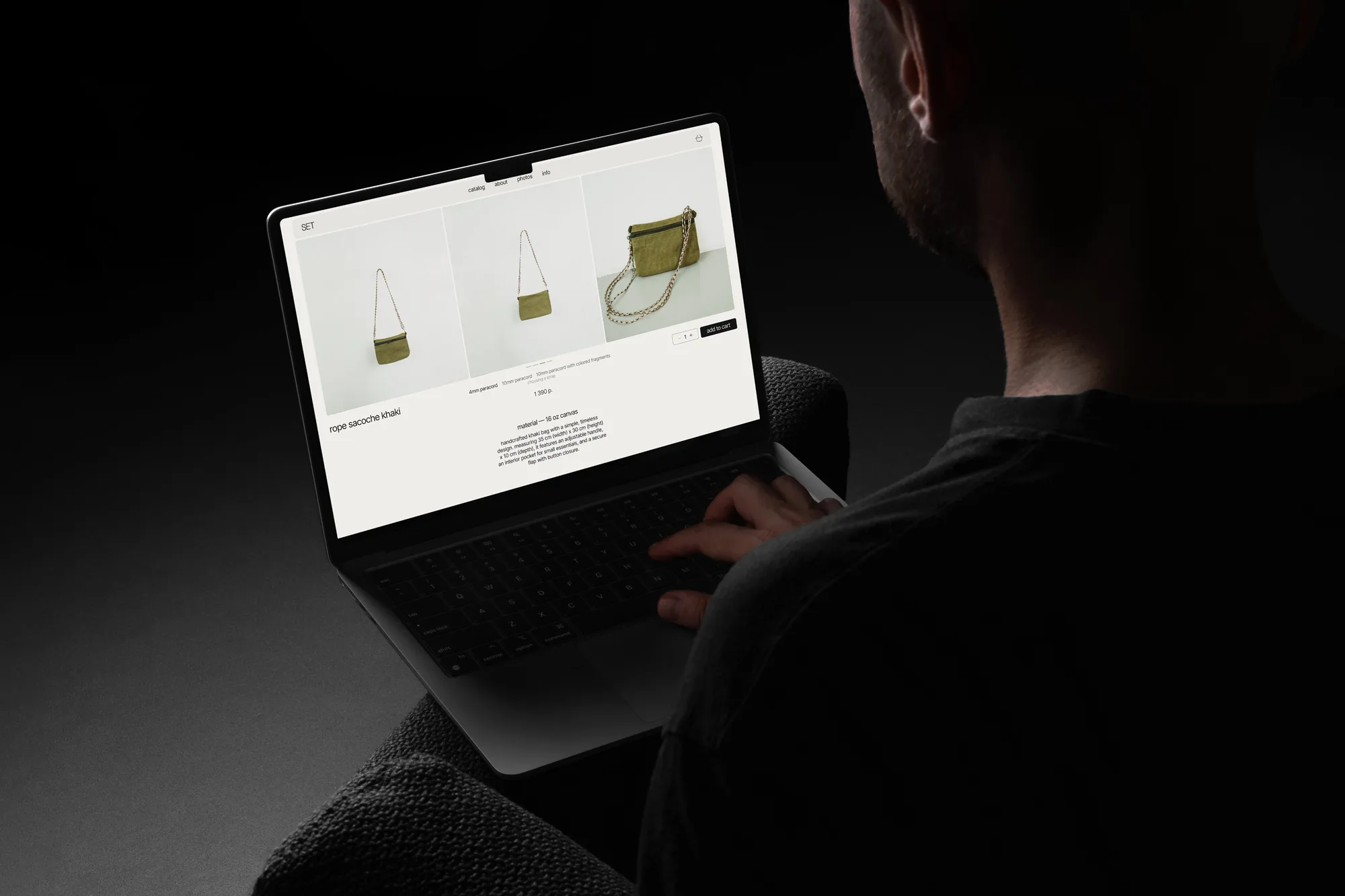 Designer working on the SET online store product page on a laptop